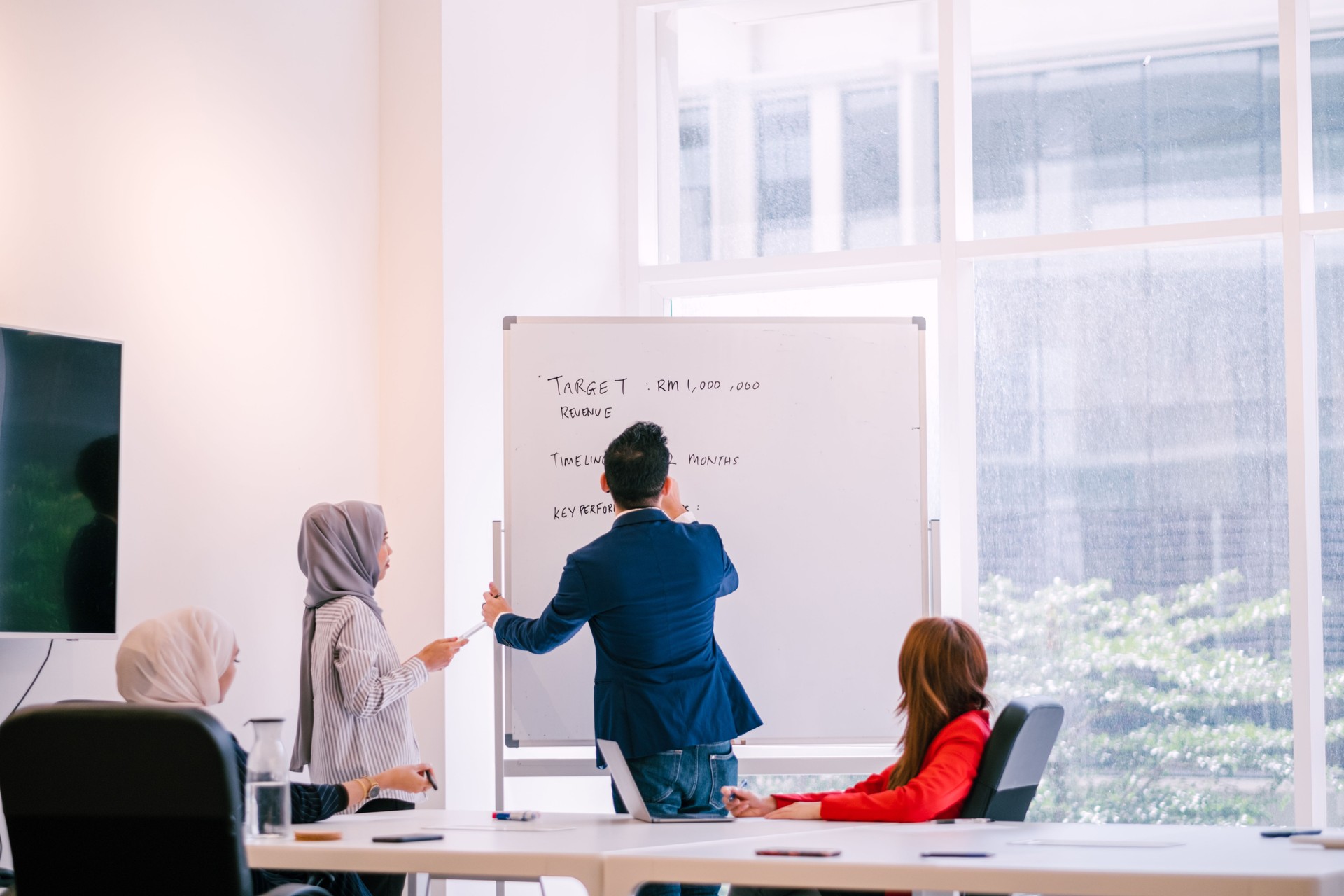 Group of Multiracial People Having a Discussion During Meeting